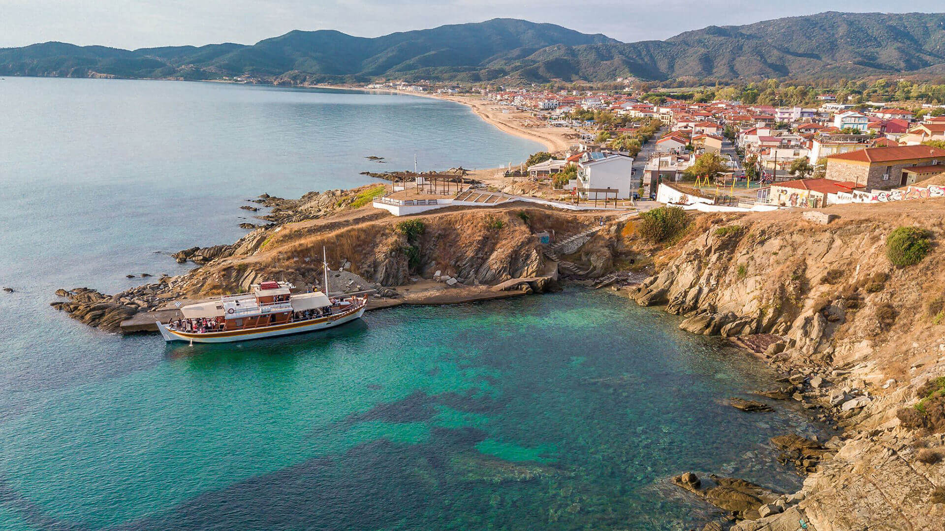 Sarti's small harbor with the village in the background